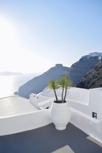 Swimming pool by sea against clear sky