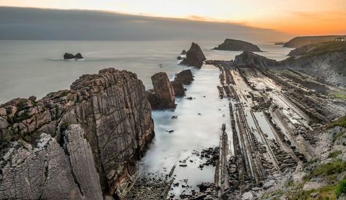 Scenic view of sea at sunset