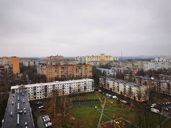 High angle view of buildings in city against sky