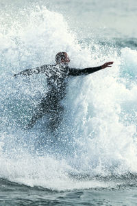 Man surfing in sea