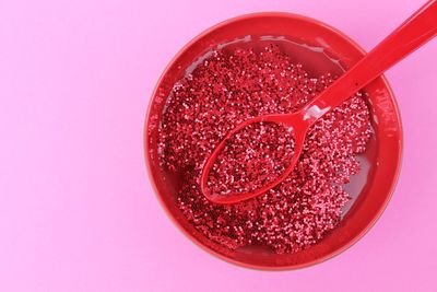 Close-up of red drink against white background