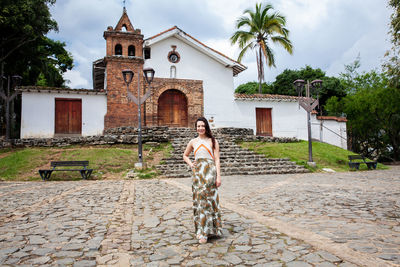 Beautiful young woman at the historical san antonio church located in the city of cali in colombia
