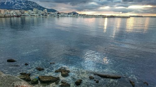 Scenic view of lake against sky during sunset