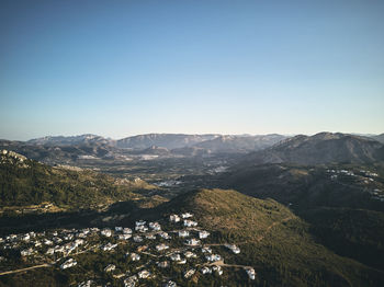 Scenic view of mountains against clear blue sky