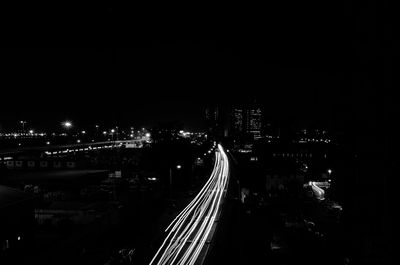 High angle view of light trails on road at night