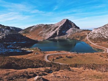 Scenic view of lake and mountains against sky