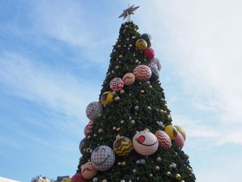 Low angle view of christmas tree against sky