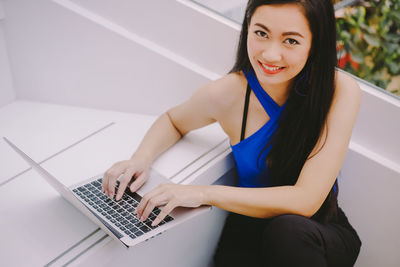 Young woman using mobile phone