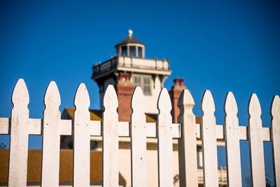 Point fermin lighthouse behind a white fence