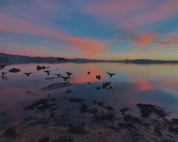 Scenic view of lake against sky during sunset