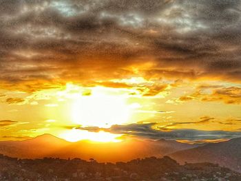 Scenic view of dramatic sky during sunset