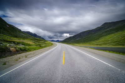 Empty road against sky