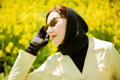 Portrait of young woman talking on phone