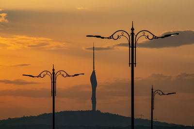Sunrise and street lamps with tower in istanbul