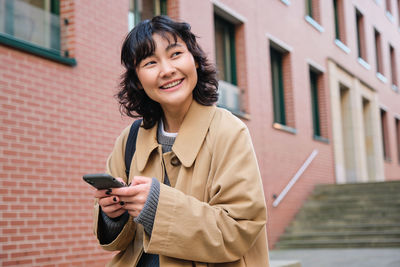 Young woman using mobile phone