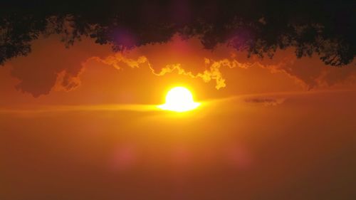 Scenic view of dramatic sky during sunset