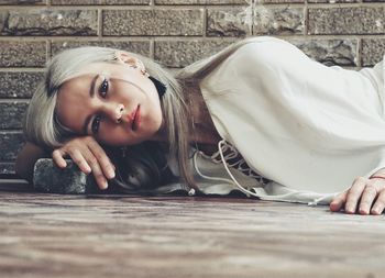 Close-up portrait of woman lying down