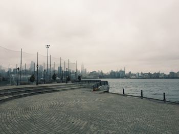 View of city against cloudy sky