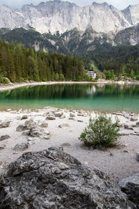 Scenic view of lake and mountains against sky