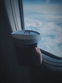 Close-up of hand holding coffee cup