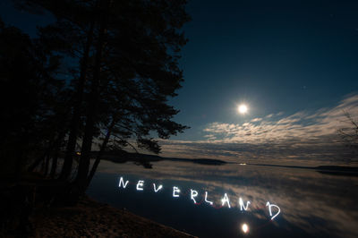 Scenic view of sea against sky at night