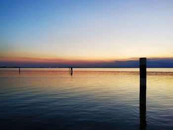 Scenic view of sea against clear sky during sunset