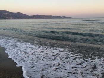 Scenic view of sea at sunrise