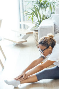 High angle view of woman sitting on table