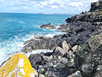 Scenic view of sea shore against sky