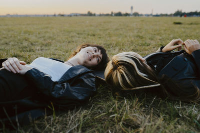 Woman resting on field