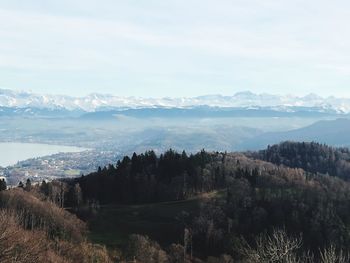 Scenic view of landscape and mountains against sky