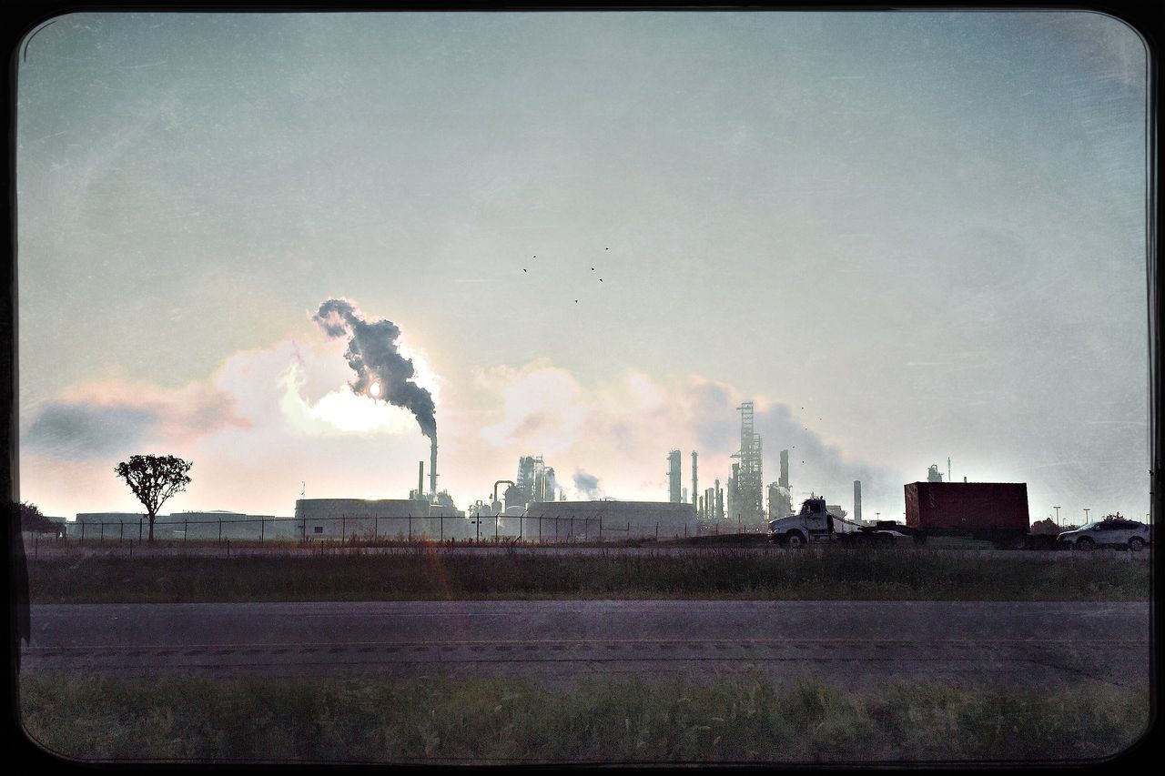 industry, architecture, built structure, factory, building exterior, auto post production filter, sky, air pollution, mid distance, smoke stack, emitting, smoke - physical structure, pollution, toxic substance, smoke, day, cloud, outdoors, cloud - sky, tall, industrial building, chimney, atmospheric, development