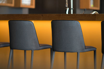 Close-up of empty chair on table
