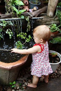 Full length of cute baby girl in water