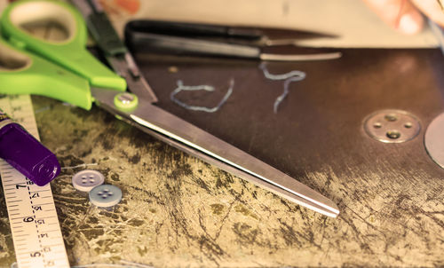 High angle view of sewing items on table