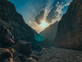 Sunshine through a cloud on a late afternoon in a wadi.