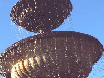 Close-up of bread against blue sky on sunny day