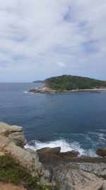 View of calm sea against cloudy sky