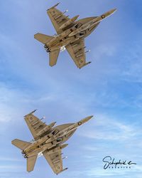 Low angle view of airplane flying against sky