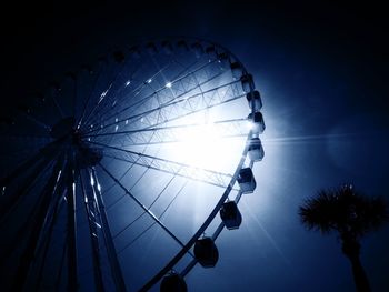Low angle view of illuminated ferris wheel