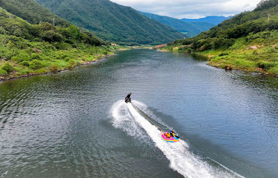 People kayaking in river