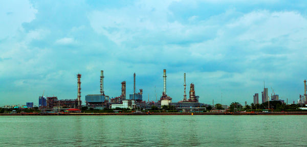 Commercial dock by sea against sky