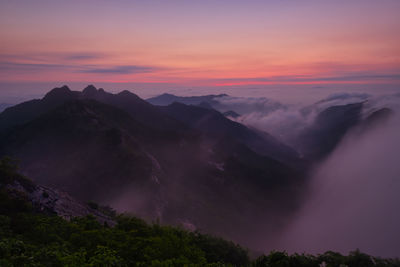 Scenic view of mountains against sky during sunset