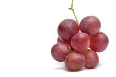 Close-up of grapes against white background