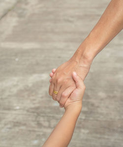 Midsection of woman holding hands