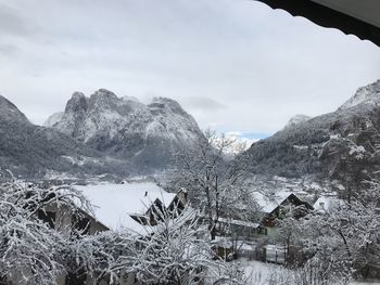 Scenic view of snowcapped mountains against sky