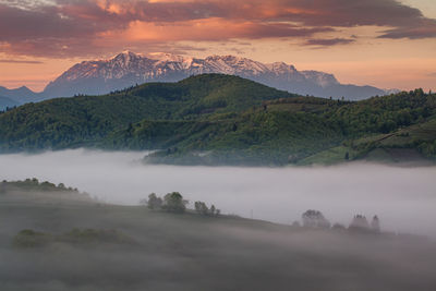 Scenic view of mountains against sky during sunset