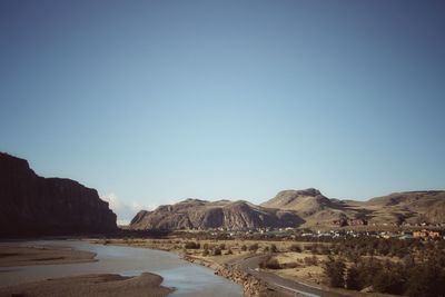 Scenic view of landscape against clear blue sky