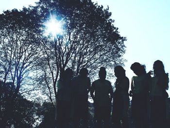 Rear view of silhouette people against clear sky