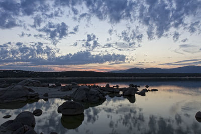 Scenic view of lake at sunset